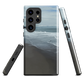 Phone case with a scenic photo of Riversdale Beach and ocean waves.