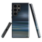 Dark abstract phone case with blue and grey streaks and glossy finish.