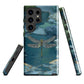 Nature-inspired phone case featuring a dragonfly over calm water with blue and green forest tones.